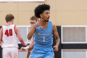 Meadowdale’s Noah Million reacts after making a three point shot during the game against Snohomish on Monday, Jan. 5, 2026 in Snohomish, Washington. (Olivia Vanni / The Herald)