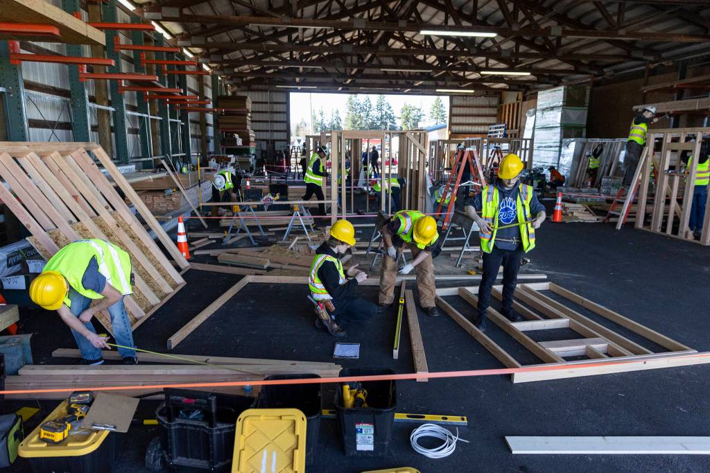Students work in groups to complete their construction projects on Tuesday, Feb. 10, 2026 in Marysville, Washington. (Olivia Vanni / The Herald)