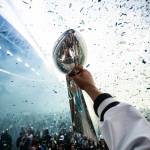 A Seattle Seahawk lifts the Lombardi Trophy as confetti flies during a Super Bowl celebration at Lumen Field in Seattle, Washington on Wednesday, Feb. 11, 2026. (Photo courtesy of the Seattle Seahawks)