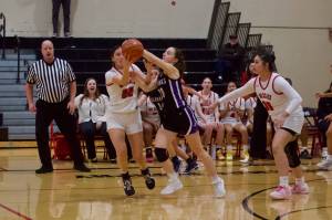 Archbishop Murphy junior Kyla Fryberg pries the ball from Anacortes junior Aubrey Michael during the Wildcats' 76-18 win against the Seahawks in the District 1 2A quarterfinals at Archbishop Murphy High School on Feb. 12, 2026. (Joe Pohoryles/The Herald)