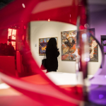 A person pauses to look at an art piece during the Schack Art Center’s 50th anniversary celebration on Thursday, Oct. 10, 2024 in Everett, Washington. (Olivia Vanni / The Herald)