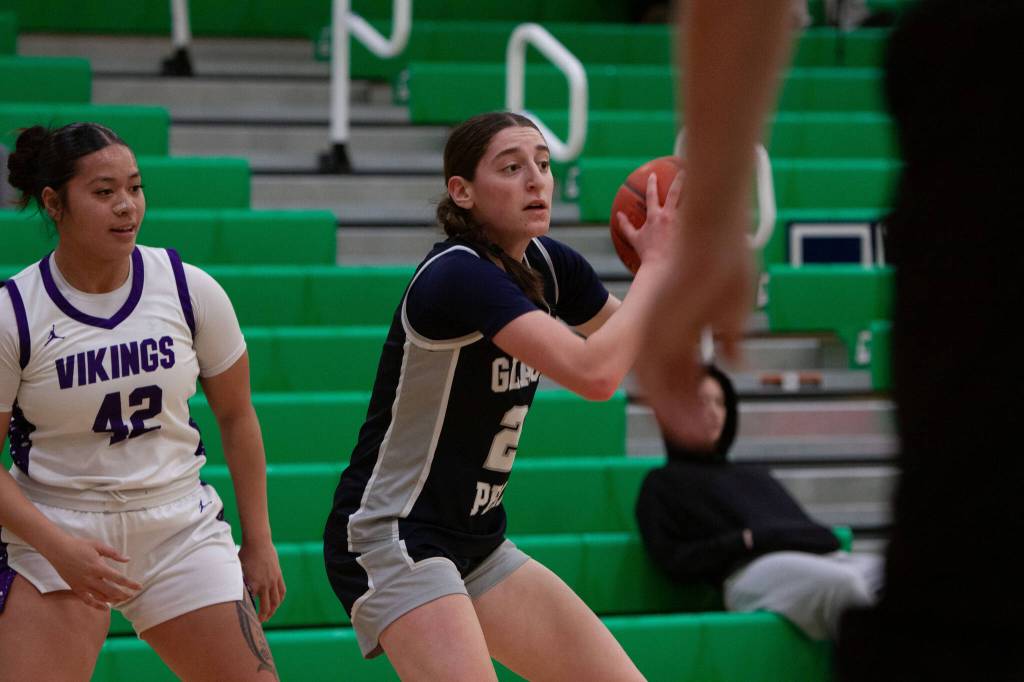 Glacier Peak girls basketballs Lily Riechelson holds the ball during a district playoff game against Lake Stevens on Thursday, Feb. 19, 2026 at Woodinville H.S. in Woodinville. (Qasim Ali / The Herald)