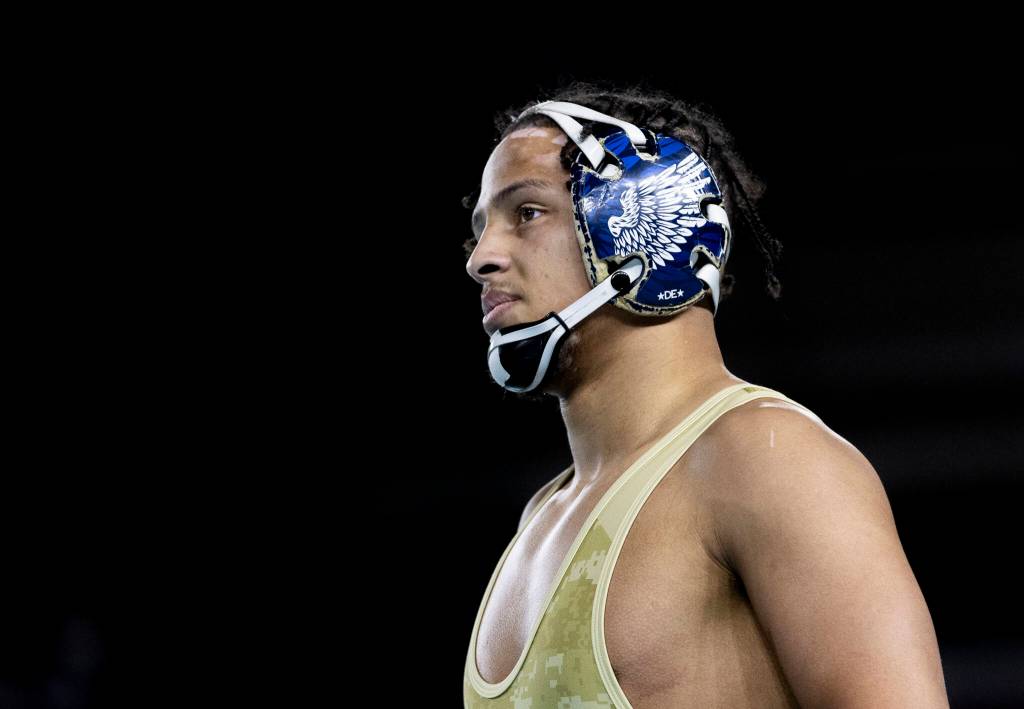 Arlingtons Tre Haines looks on during the 4A boys 165-pound championship match at the Mat Classic on Friday, Feb. 20, 2026 in Tacoma, Washington. (Olivia Vanni / The Herald)