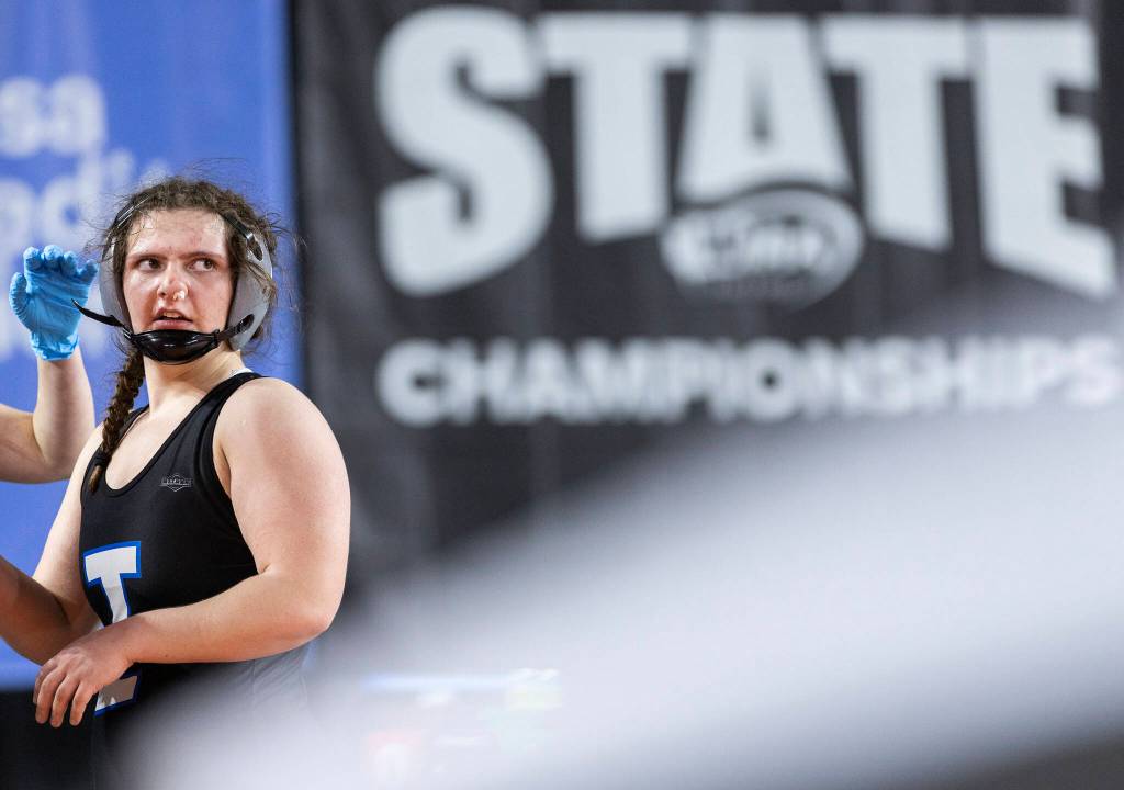 A wrestler has blood cleaned from their face at the Mat Classic on Friday, Feb. 20, 2026 in Tacoma, Washington. (Olivia Vanni / The Herald)