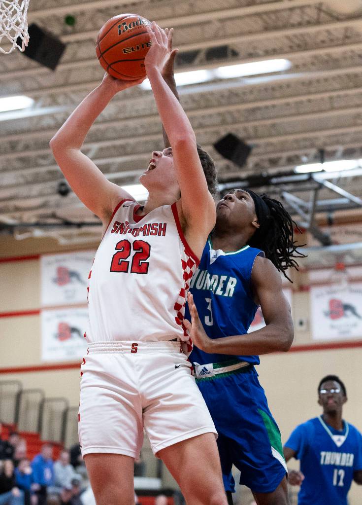 Snohomishs Deyton Wheat makes a layup against Mountain Views Cordae Brown during the 3A state opening round loser-out game on Tuesday, Feb. 24, 2026 in Snohomish, Washington. (Olivia Vanni / The Herald)