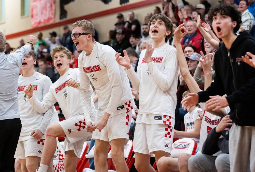 The Snohomish bench reacts to Snohomishs Grady Rohrich makes a three-point shot during the 3A state opening round loser-out game against Mountain View on Tuesday, Feb. 24, 2026 in Snohomish, Washington. (Olivia Vanni / The Herald)