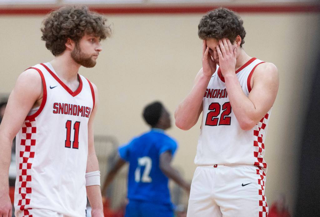 Snohomishs Deyton Wheat and Grady Rohrich react to losing to Mountain View in the 3A state opening round loser-out game on Tuesday, Feb. 24, 2026 in Snohomish, Washington. (Olivia Vanni / The Herald)