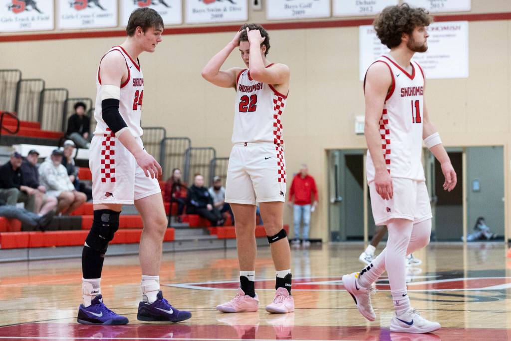 Snohomishs Luke Davis, Deyton Wheat and Grady Rohrich react to losing to Mountain View in the 3A state opening round loser-out game on Tuesday, Feb. 24, 2026 in Snohomish, Washington. (Olivia Vanni / The Herald)