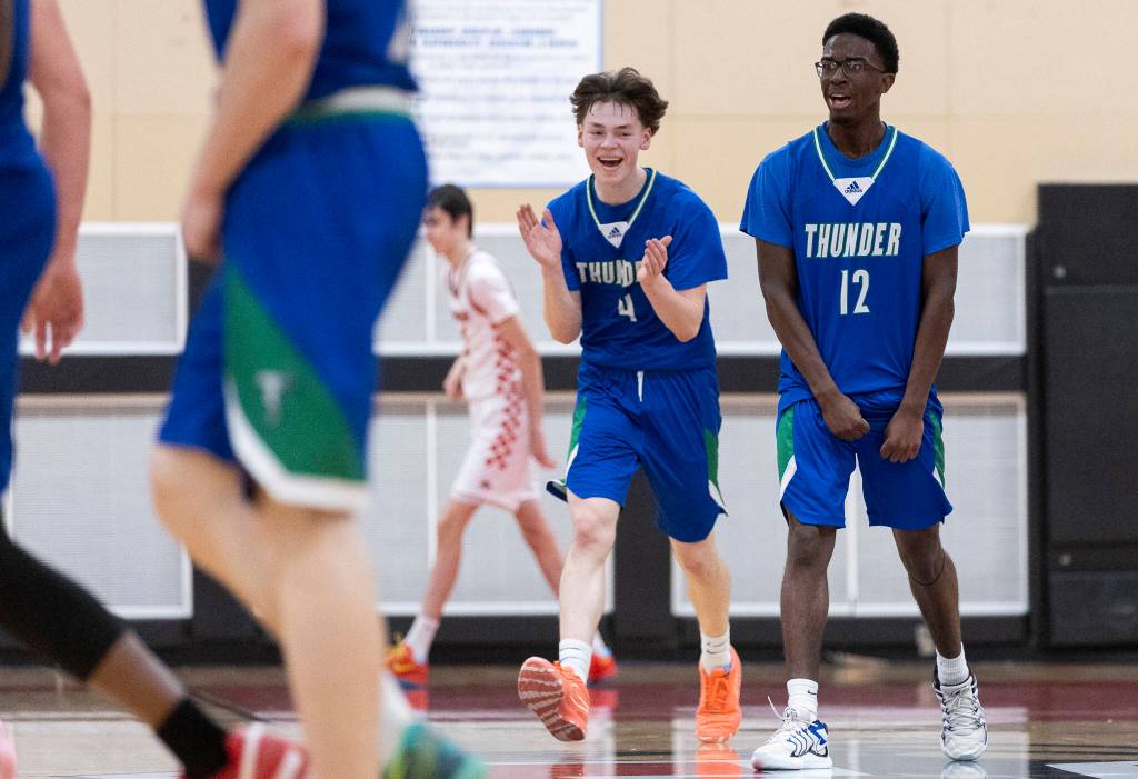 Mountain Views Luke Swerdlik and Zeke Willis react to Snohomish calling a timeout after Mountain View pulls ahead by 10-point during the 3A state opening round loser-out game on Tuesday, Feb. 24, 2026 in Snohomish, Washington. (Olivia Vanni / The Herald)