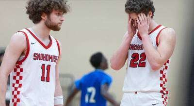 Snohomish’s Deyton Wheat and Grady Rohrich react to losing to Mountain View in the 3A state opening round loser-out game on Tuesday, Feb. 24, 2026 in Snohomish, Washington. (Olivia Vanni / The Herald)