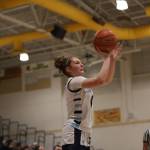 Meadowdale's Mia Brockmeyer takes a 3-pointer during a state basketball game against River Ridge on Tuesday, Feb. 24, 2026 at Edmonds-Woodway H.S. in Edmonds. (Qasim Ali / The Herald)