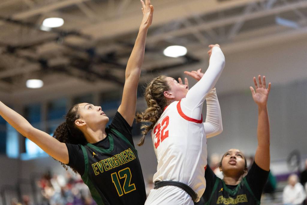 Snohomishs Lola Rotondo follows through on a layup during a state basketball game against Evergreen (Vancouver) on Saturday, Feb. 28, 2026 in Bothell. (Qasim Ali / The Herald)