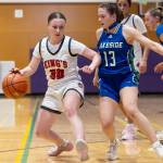 Kings Adeline Cox tries to dribble around Lakesides Jillian Owen during the 2A state opening round game on Friday, Feb. 27, 2026 in Bothell, Washington. (Olivia Vanni / The Herald)