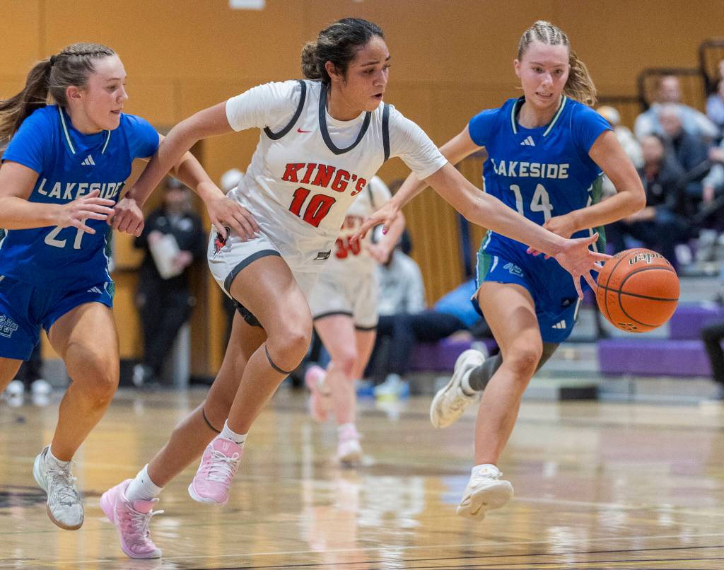 Kings Kaleo Anderson takes the ball up the court during the 2A state opening round game against Lakeside on Friday, Feb. 27, 2026 in Bothell, Washington. (Olivia Vanni / The Herald)