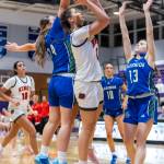 Kings Kaitlin Cramer shoots a layup while Lakesides Bella Tobeck defends during the 2A state opening round game on Friday, Feb. 27, 2026 in Bothell, Washington. (Olivia Vanni / The Herald)
