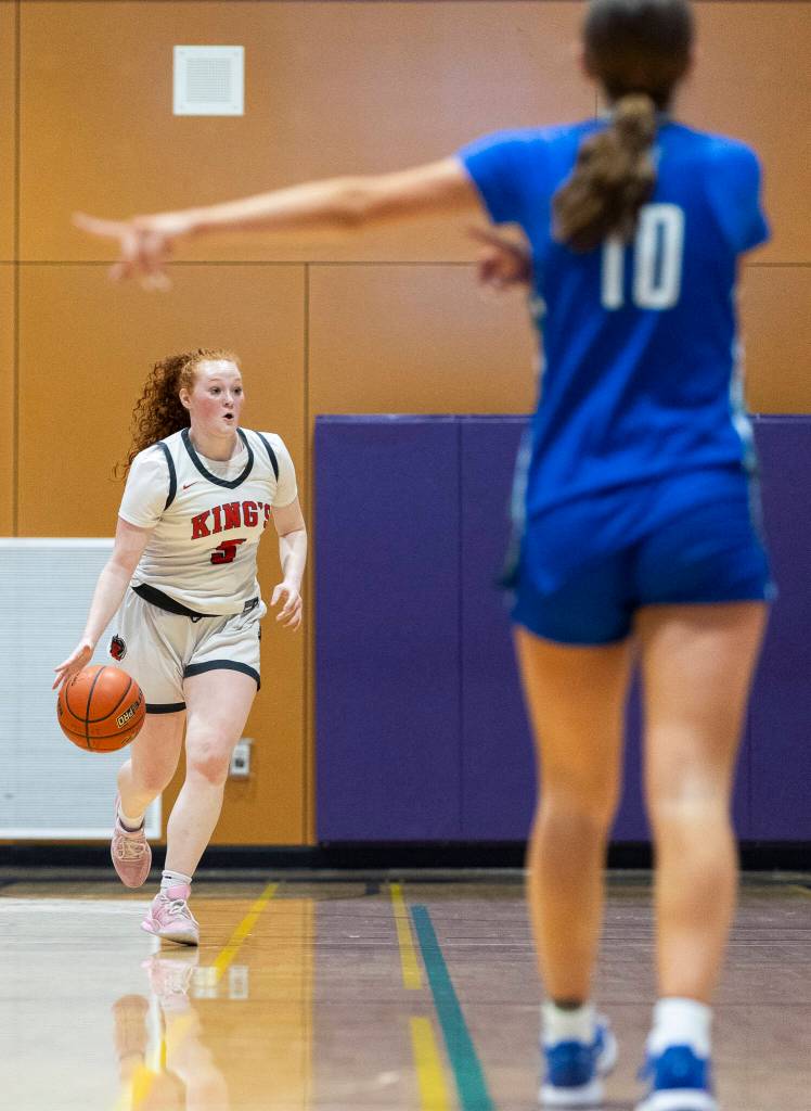 Kings Eleanor Gaydos takes the ball up the court during the 2A state opening round game against Lakeside on Friday, Feb. 27, 2026 in Bothell, Washington. (Olivia Vanni / The Herald)