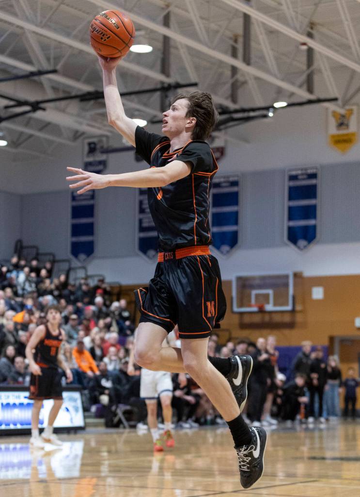 Monroes Caleb Campbell lays up the ball during the 3A state opening round loser-out game against Shorewood on Friday, Feb. 27, 2026 in Bothell, Washington. (Olivia Vanni / The Herald)