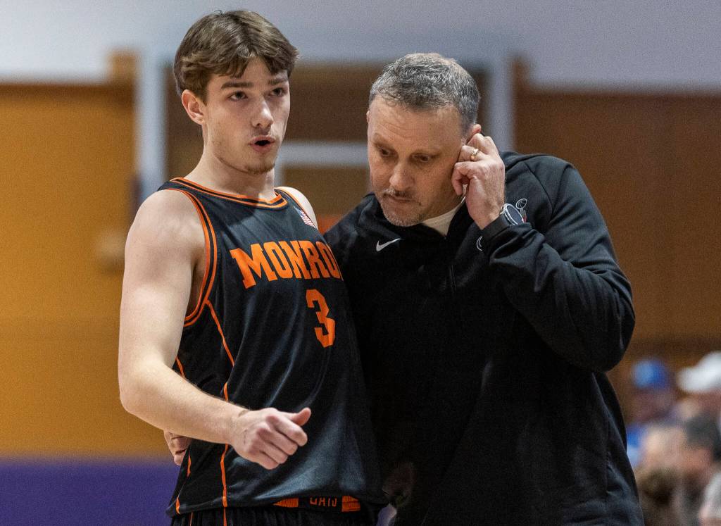 Monroes Isaiah Kiehl talks to Monroe head coach Justin Prohn during the 3A state opening round loser-out game against Shorewood on Friday, Feb. 27, 2026 in Bothell, Washington. (Olivia Vanni / The Herald)