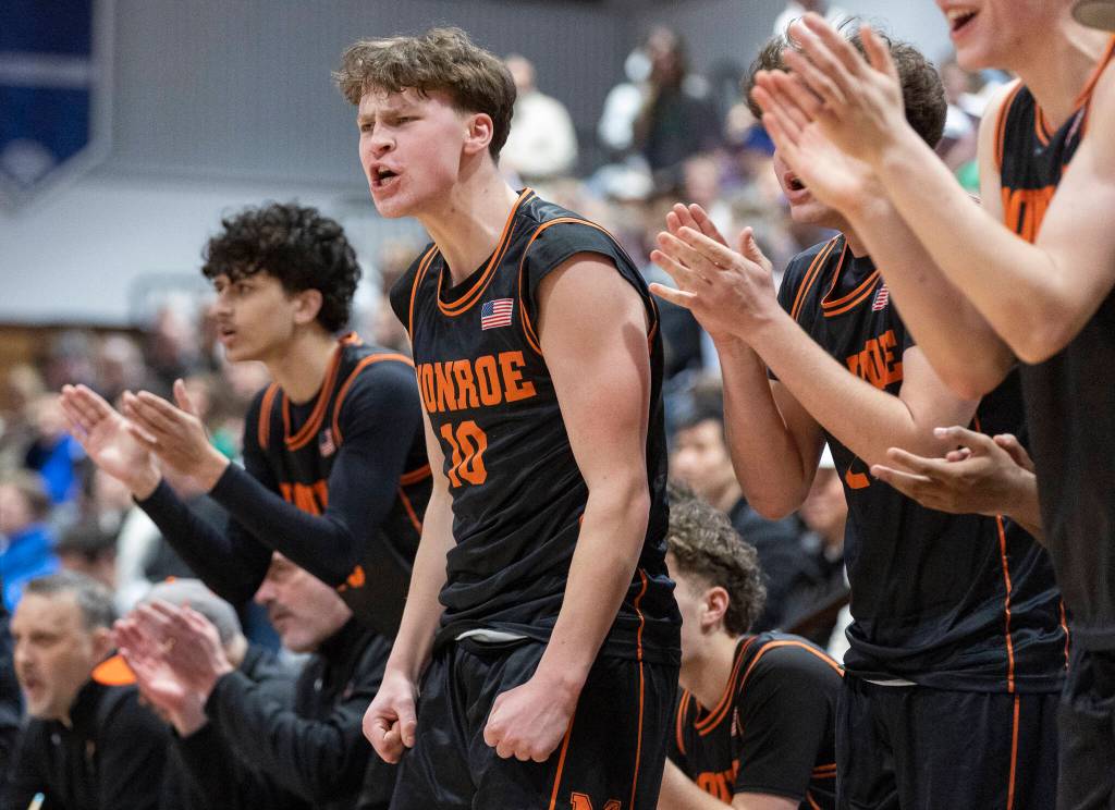 Monroes Carson Moen yells after a score during the 3A state opening round loser-out game against Shorewood on Friday, Feb. 27, 2026 in Bothell, Washington. (Olivia Vanni / The Herald)