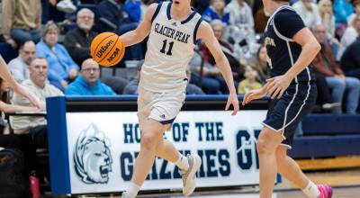 Glacier Peak’s Reed Nagel takes the ball up the court against Arlington’s Maveric Vaden during the game on Friday, Jan. 16, 2026 in Snohomish, Washington. (Olivia Vanni / The Herald)