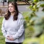 Makena Simonen, 21, outside of her family home on Wednesday, Jan. 14, 2026 in Lynnwood, Washington. (Olivia Vanni / The Herald)