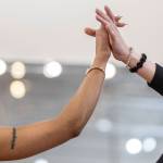 Student Taiyah Chapman holds the hands of her dance instructor Brady Uker during her lesson at the Arthur Murray Dance Center on Tuesday, Jan. 13, 2026 in Everett, Washington. (Olivia Vanni / The Herald)