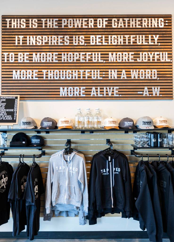 Merchandise available at the new Tapped Public House at the Port of Everett on Tuesday, March 3, 2026 in Everett, Washington. (Olivia Vanni / The Herald)