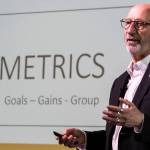 Edmonds Mayor Mike Rosen presents metrics for the different areas of the city from police to water treatment during the “State of the City” address on Monday, March 16, 2026 in Edmonds, Washington. (Olivia Vanni / The Herald)