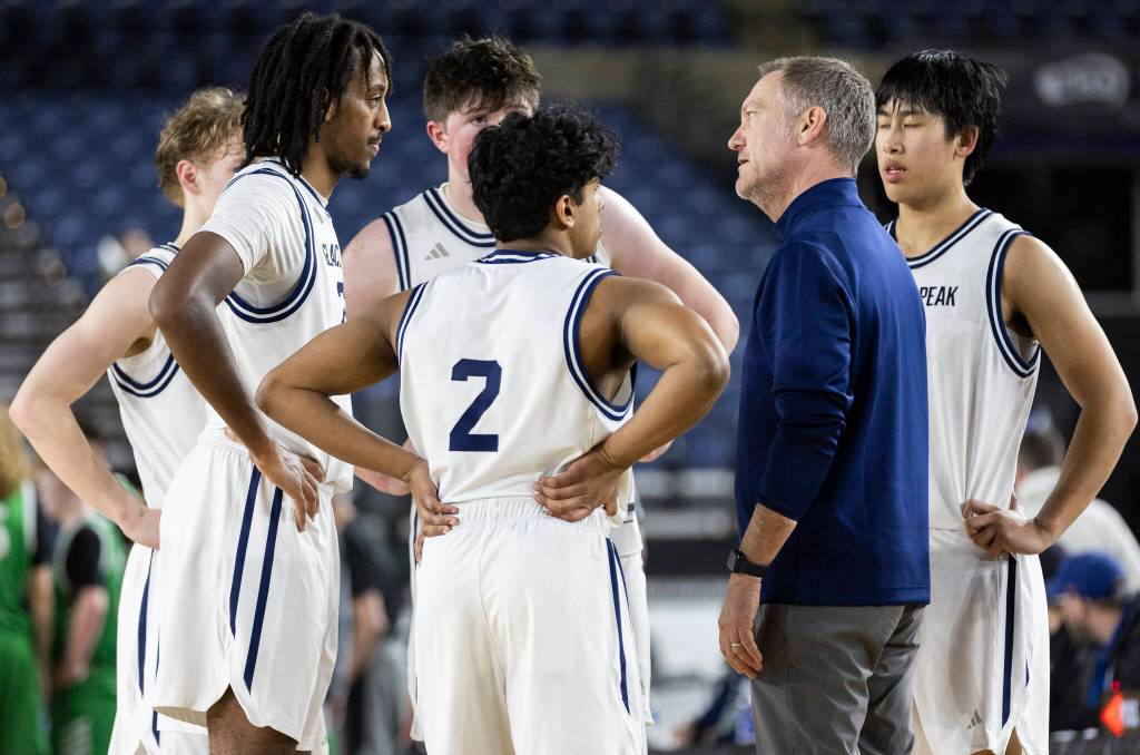 Glacier Peak head coach Brian Hunter talks to his players during a timeout during the 4A state game against Woodinville on Wednesday, March 4, 2026 in Tacoma, Washington. (Olivia Vanni / The Herald)