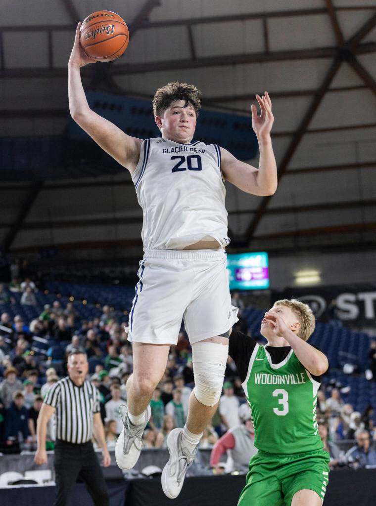 Glacier Peaks Zachary Albright leaps in the air to make shot during the 4A state game against Woodinville on Wednesday, March 4, 2026 in Tacoma, Washington. (Olivia Vanni / The Herald)