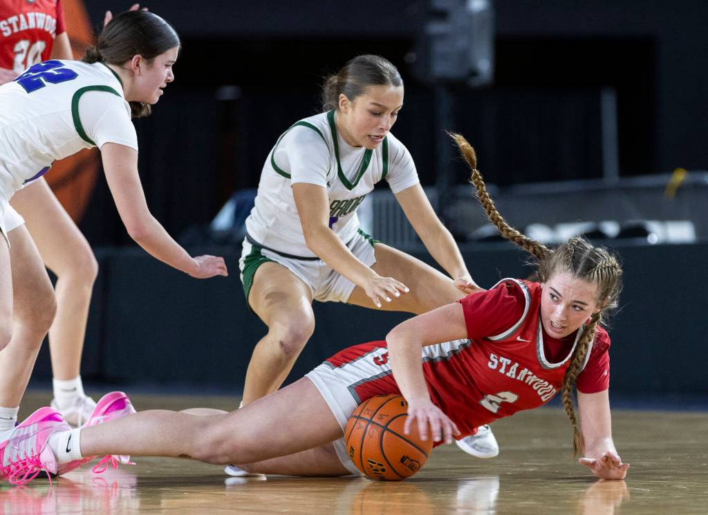 Stanwoods Ellalee Wortham dives for a loose ball during the 3A state game against Edmonds-Woodway on Wednesday, March 4, 2026 in Tacoma, Washington. (Olivia Vanni / The Herald)