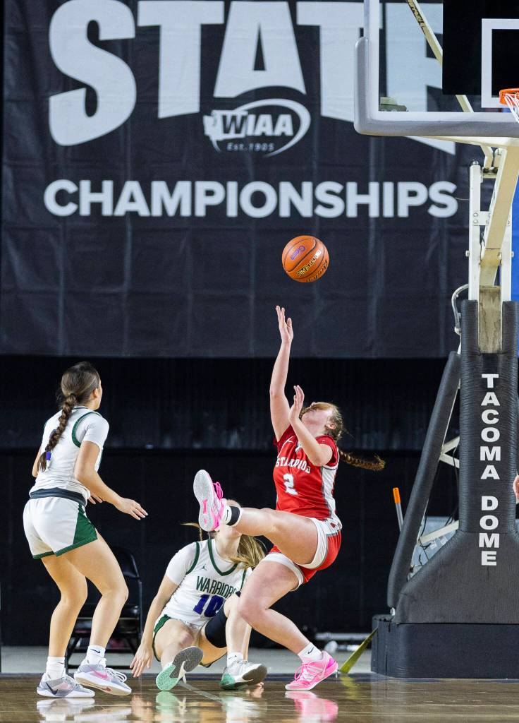 Stanwoods Ellalee Wortham tires to throw up a shot while falling during the 3A state game against Edmonds-Woodway on Wednesday, March 4, 2026 in Tacoma, Washington. (Olivia Vanni / The Herald)