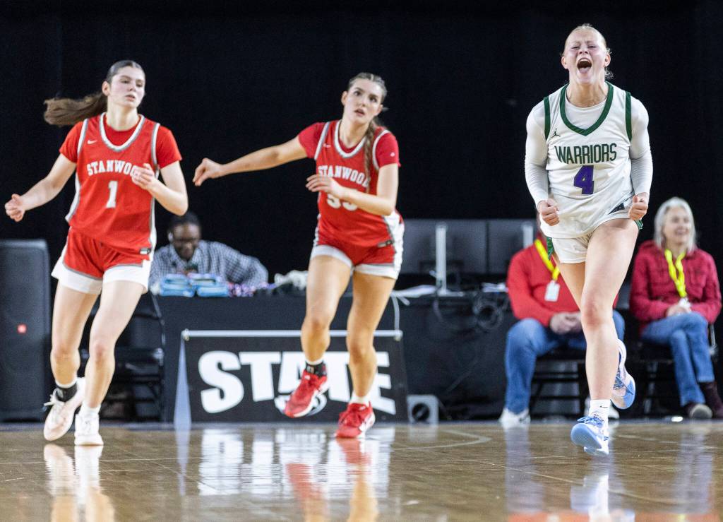 Edmonds-Woodways Finley Wichers reacts after hitting a three-point shot during the 3A state game against Stanwood on Wednesday, March 4, 2026 in Tacoma, Washington. (Olivia Vanni / The Herald)