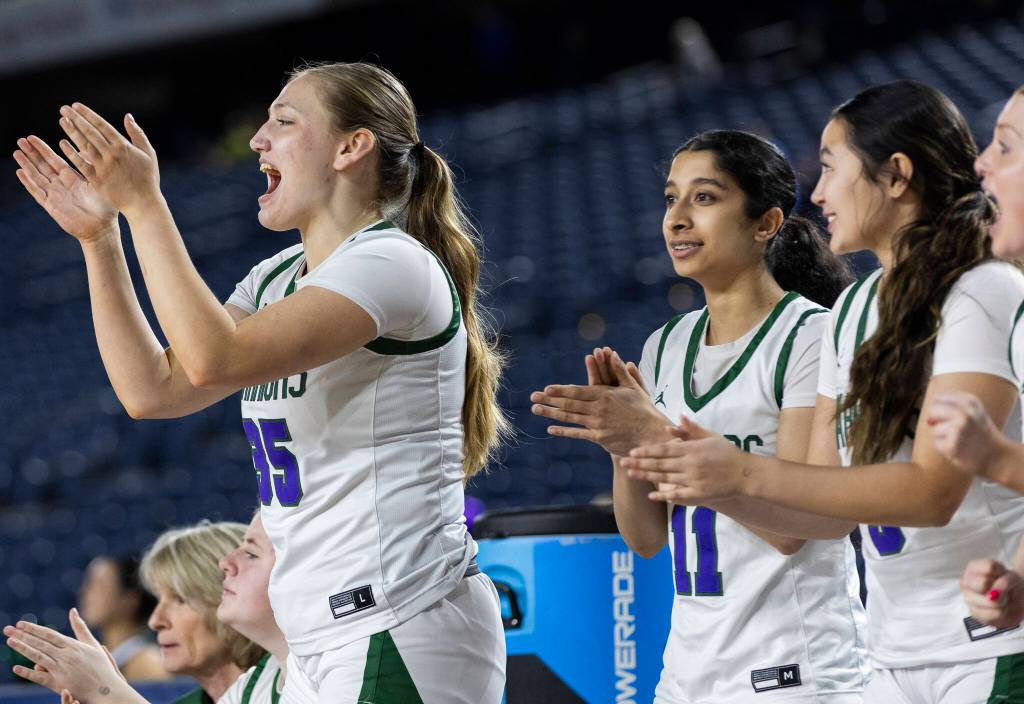 Edmonds-Woodways Abigail Johnson cheers from the bench during the 3A state game against Stanwood on Wednesday, March 4, 2026 in Tacoma, Washington. (Olivia Vanni / The Herald)