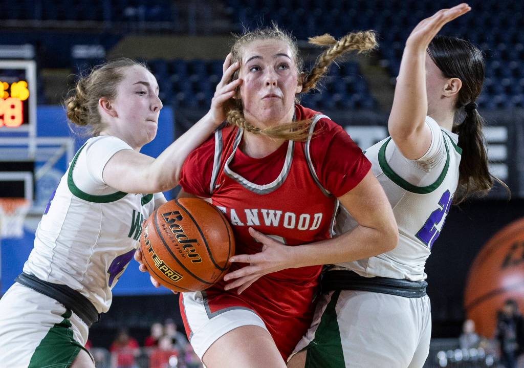 Stanwoods Ellalee Wortham is fouled by Edmonds-Woodways Amelia Faber during the 3A state game on Wednesday, March 4, 2026 in Tacoma, Washington. (Olivia Vanni / The Herald)
