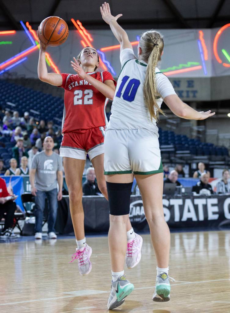 Stanwoods Georgia Lenz takes a jump shot while Edmonds-Woodways Audrey Rothmier defends during the 3A state game on Wednesday, March 4, 2026 in Tacoma, Washington. (Olivia Vanni / The Herald)