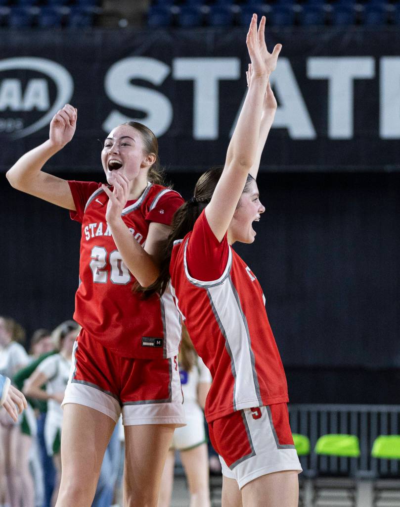 Stanwoods Presley Harris and Dorothy Berrett react to beating Edmonds-Woodway in the 3A state game on Wednesday, March 4, 2026 in Tacoma, Washington. (Olivia Vanni / The Herald)