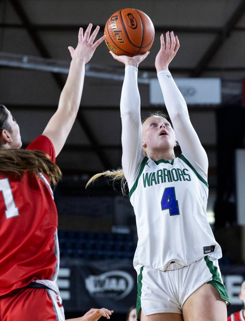 Edmonds-Woodways Finley Wichers takes a jump shot while Stanwoods Dorothy Berrett defends during the 3A state game on Wednesday, March 4, 2026 in Tacoma, Washington. (Olivia Vanni / The Herald)