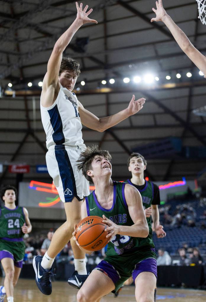 Edmonds-Woodways Dennis Karl looks to shoot he ball during the 3A state quarterfinal game Bellarmine Prep on Thursday, March 5, 2026 in Tacoma, Washington. (Olivia Vanni / The Herald)
