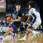 Edmonds-Woodways Andreas Simonsen takes the ball up the court during the 3A state quarterfinal game Bellarmine Prep on Thursday, March 5, 2026 in Tacoma, Washington. (Olivia Vanni / The Herald)