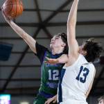 Edmonds-Woodways Joaquin Escandon lays up the ball during the 3A state quarterfinal game Bellarmine Prep on Thursday, March 5, 2026 in Tacoma, Washington. (Olivia Vanni / The Herald)