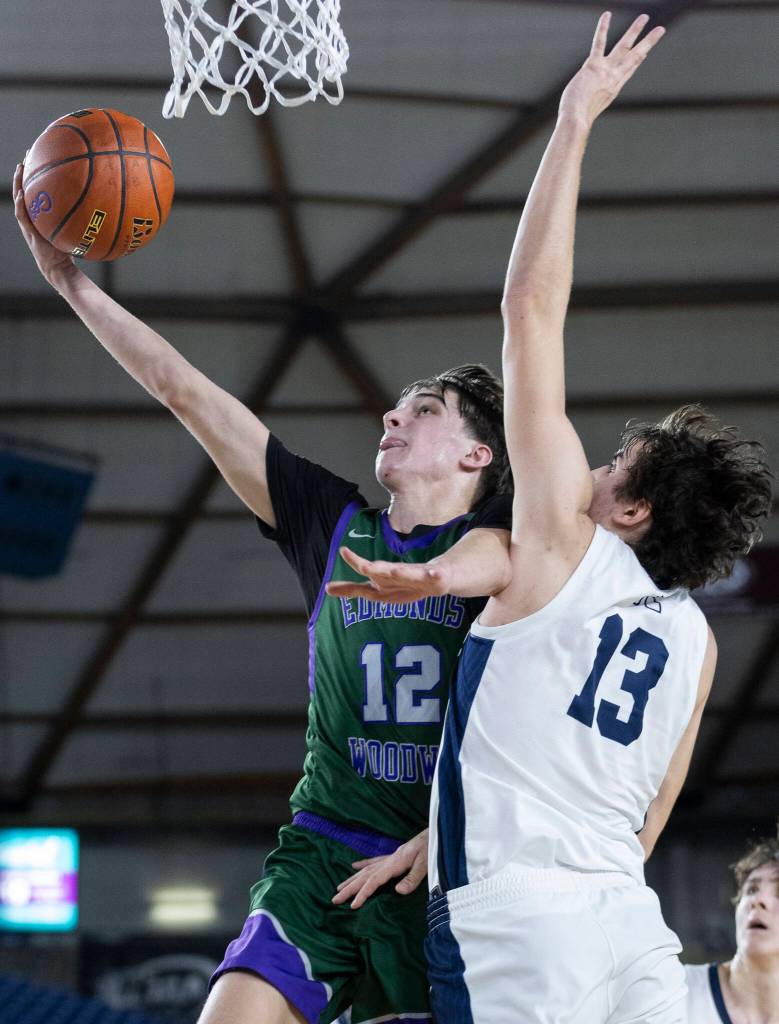 Edmonds-Woodways Joaquin Escandon lays up the ball during the 3A state quarterfinal game Bellarmine Prep on Thursday, March 5, 2026 in Tacoma, Washington. (Olivia Vanni / The Herald)