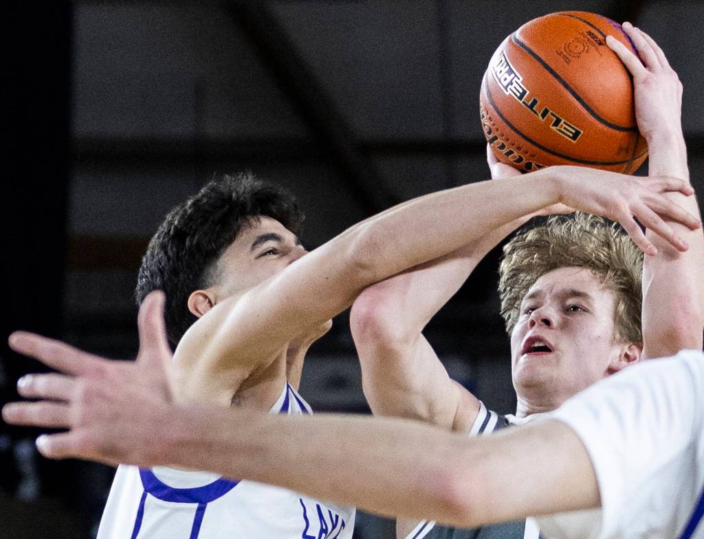 Glacier Peaks Reed Nagel is fouled while taking a jump shot during the 4A state quarterfinal game against Lake Washington on Thursday, March 5, 2026 in Tacoma, Washington. (Olivia Vanni / The Herald)