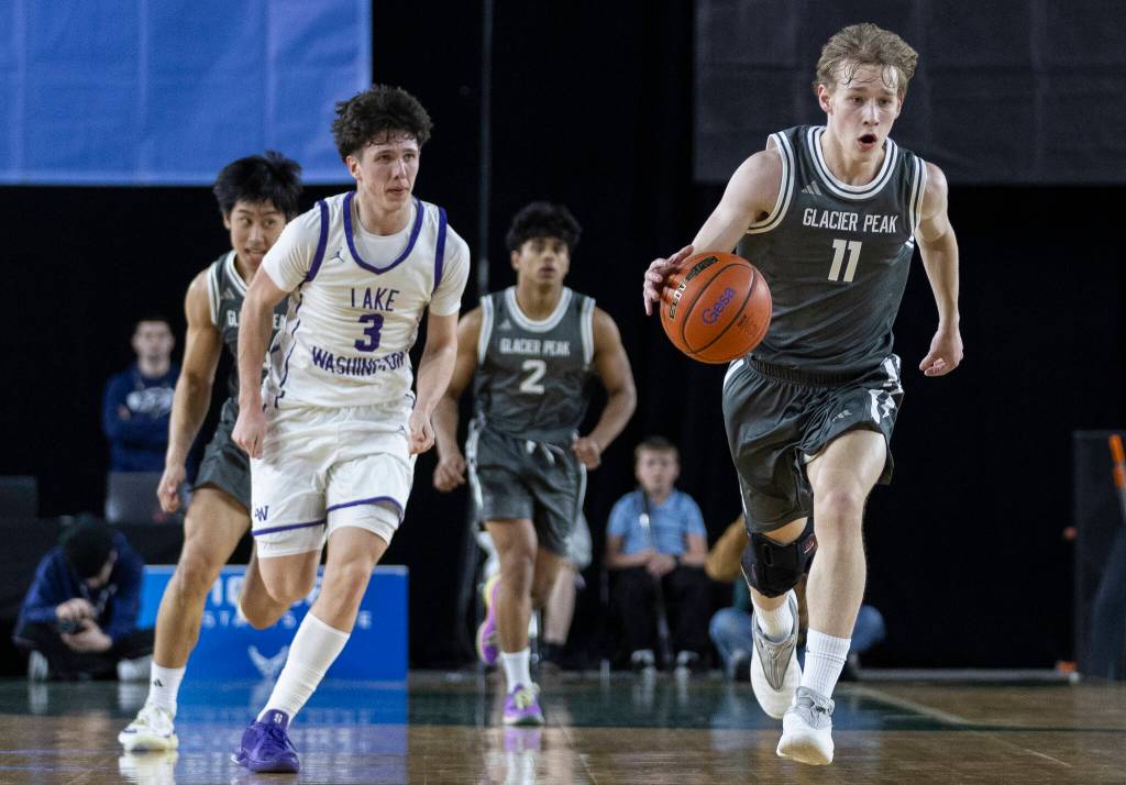 Glacier Peaks Reed Nagel takes the ball up the court during the 4A state quarterfinal game against Lake Washington on Thursday, March 5, 2026 in Tacoma, Washington. (Olivia Vanni / The Herald)