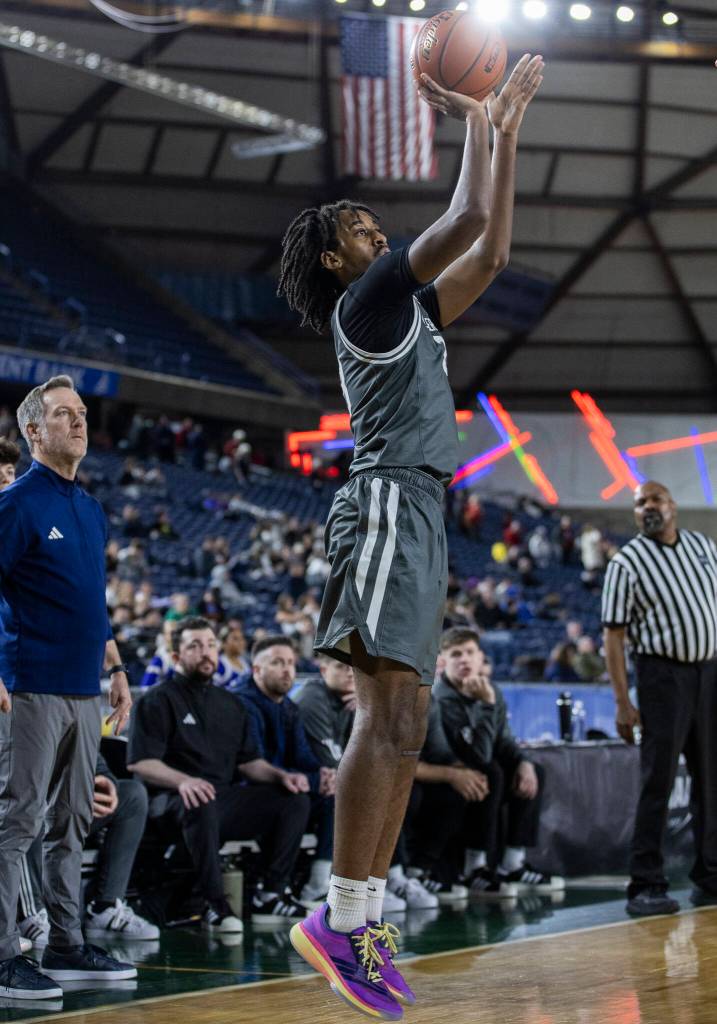 Glacier Peaks Paulos Mulugeta takes a three-point shot during the 4A state quarterfinal game against Lake Washington on Thursday, March 5, 2026 in Tacoma, Washington. (Olivia Vanni / The Herald)