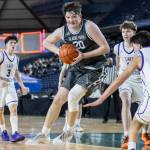 Glacier Peaks Zachary Albright jumps while attempting a shot during the 4A state quarterfinal game against Lake Washington on Thursday, March 5, 2026 in Tacoma, Washington. (Olivia Vanni / The Herald)