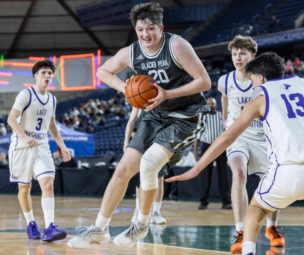 Glacier Peaks Zachary Albright jumps while attempting a shot during the 4A state quarterfinal game against Lake Washington on Thursday, March 5, 2026 in Tacoma, Washington. (Olivia Vanni / The Herald)