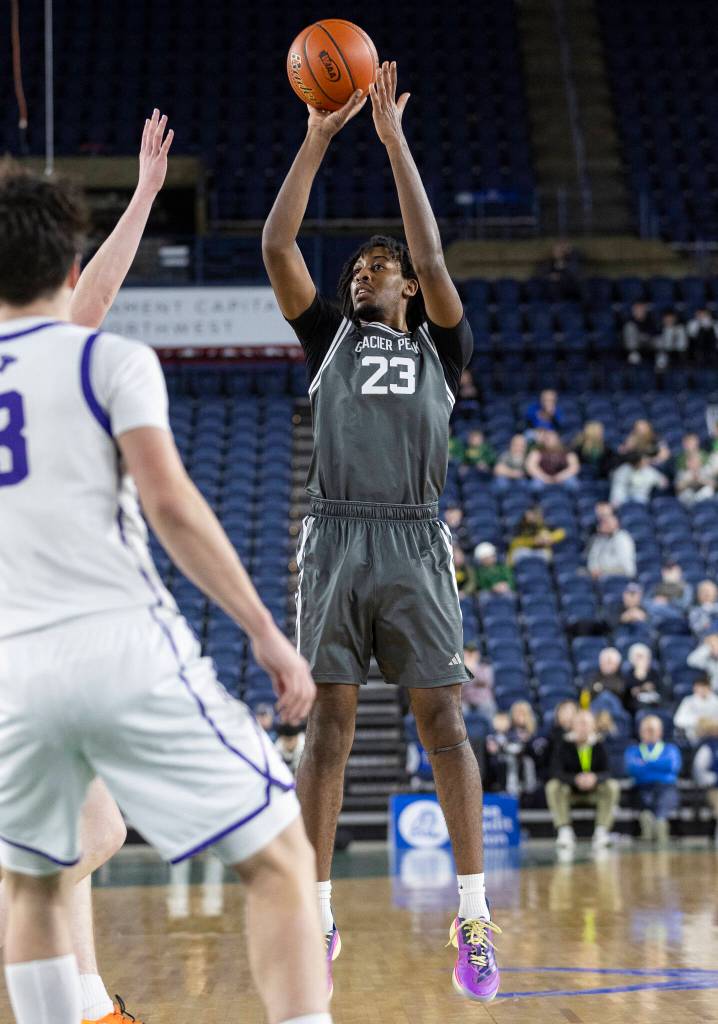 Glacier Peaks Paulos Mulugeta takes a three-point shot during the 4A state quarterfinal game against Lake Washington on Thursday, March 5, 2026 in Tacoma, Washington. (Olivia Vanni / The Herald)