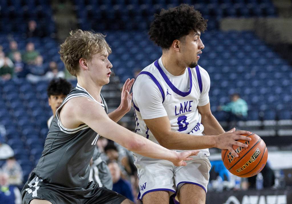 Glacier Peaks Reed Nagel reaches for the ball controlled by Lake Washingtons Matthew Adeeb during the 4A state quarterfinal game on Thursday, March 5, 2026 in Tacoma, Washington. (Olivia Vanni / The Herald)