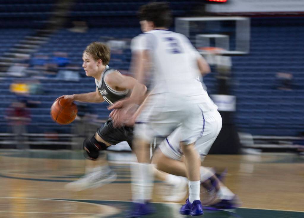 Glacier Peaks Reed Nagel takes the ball up the court during the 4A state quarterfinal game against Lake Washington on Thursday, March 5, 2026 in Tacoma, Washington. (Olivia Vanni / The Herald)